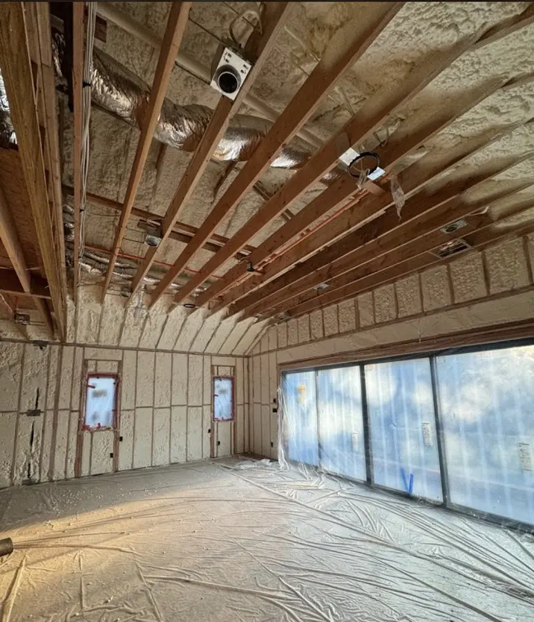 Interior walls and ceiling insulated with spray foam during new construction in Bay Village